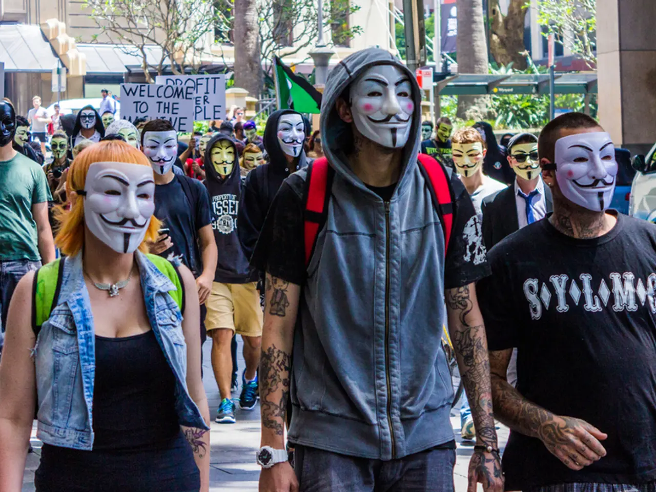 In this picture we can see many people walking on the street wearing a mask.