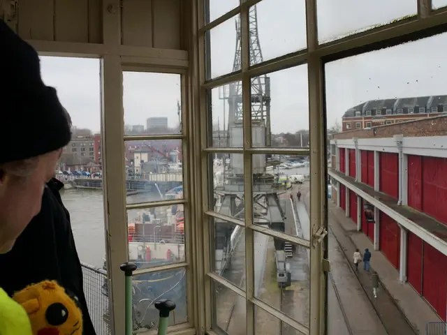 Firefighters in Munich employ a crane to rescue injured workers who have plunged into the water