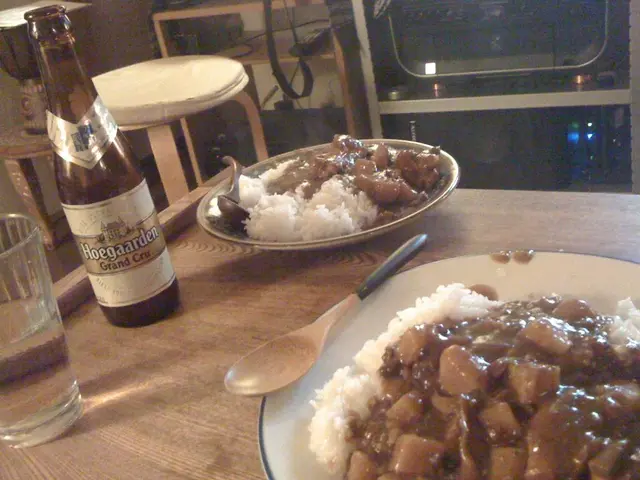 Bottom of the image there is a table, on the table there are some plates, spoons, bottles, glass...