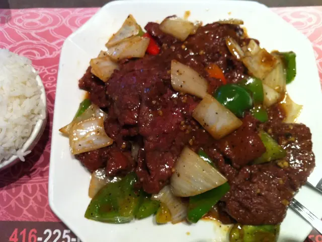 In this image, we can see a table. On the right side of the table, we can see a bowl with some...